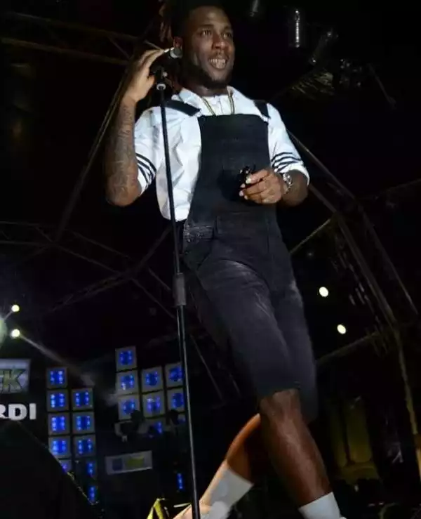 Burna Boy Shocks Fans As He Plays With Condom During Stage Performance [Photos]